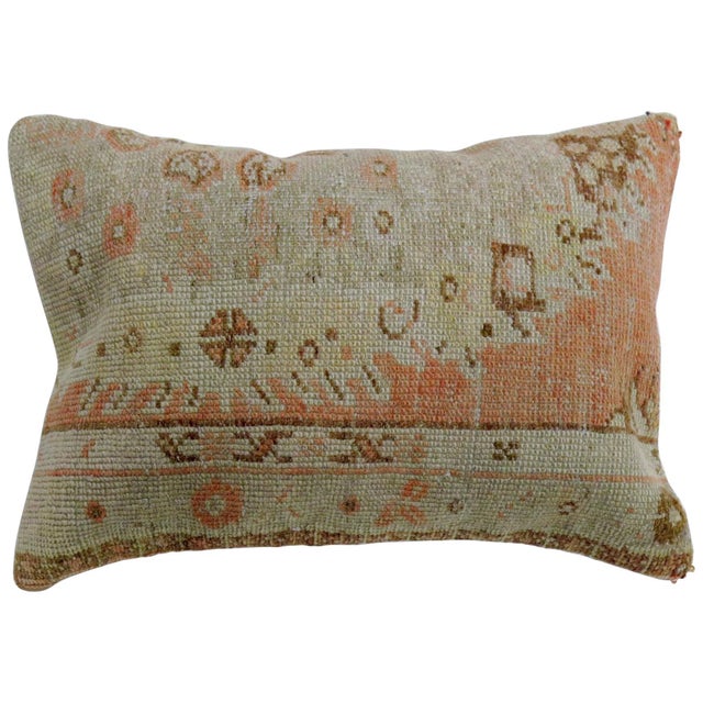Large pillow made from a 20th century Turkish Oushak rug in an orange peel tone. Measures: 16'' x 24''.