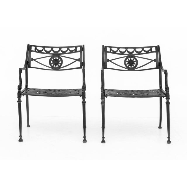 Pair of Florentine Craftsmen Star and Dolphin Cast Aluminum Arm Chairs. 30" H x 20.5" W x 22" D; seat: 15.5" H; armrest:...