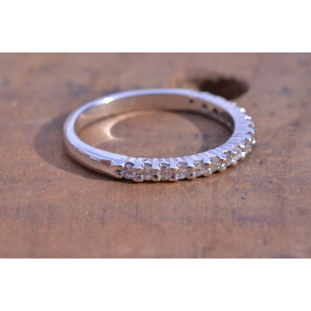 The Halley White Gold Stack-able Diamond Shared Prong Band. The estimated diamond weight by measurement is 0.20 carats....