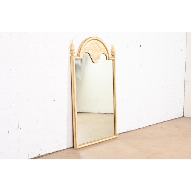 A gorgeous Neoclassical or Louis XVI style wall mirror By John Widdicomb USA, Circa 1950s Carved cherry wood frame, with...