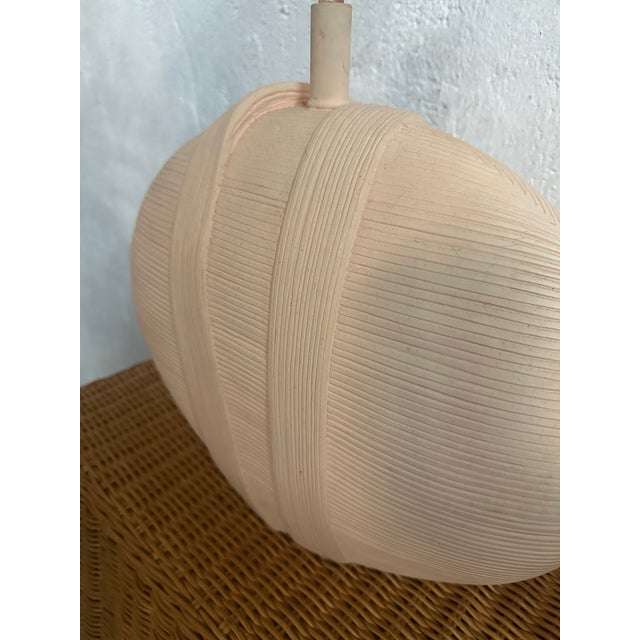 This is a sculptural pair of vintage ceramic lamps by Fine Arts Lamps of Hialeah, Florida. Each lamp features a rounded,...