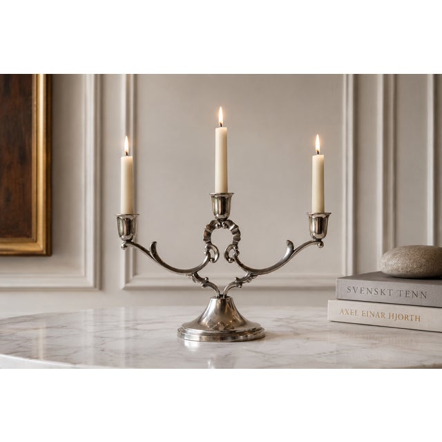 This exceptional three arm solid pewter candelabra represents a rare documented survivor from the golden age of...