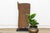 This door is a study in engineering as much as craft. Hand-hewn from a single, dense hardwood trunk, the panel and its...