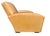 Classic club armchair upholstered in warm tan leather, featuring a deep, comfortable seat, softly sculpted arms, and a...