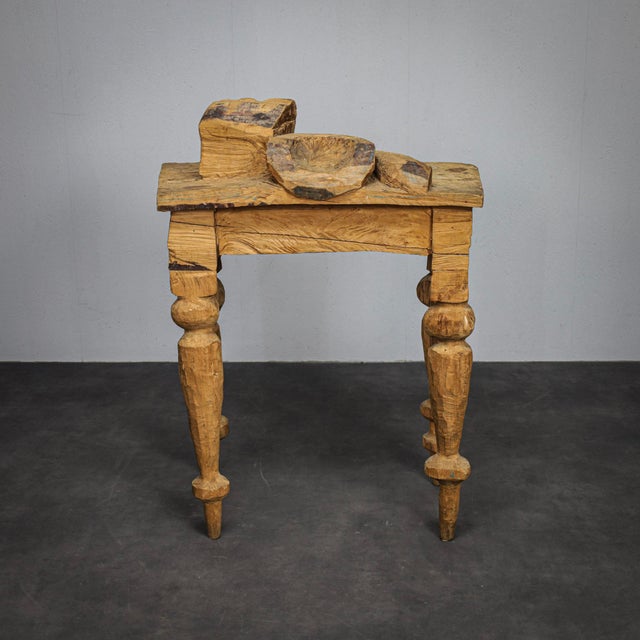 A remarkable sculptural table by dutch artist and designer emile van der kruk, carved entirely from solid wood. Titled...