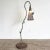 Incredible vintage hand made iron floor lamp. Shade is a metal sheep making a cone around the light which hangs from the...