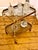 Elegant brass serving trolley from the beautiful old era, featuring two removable dark crystal glass trays on casters, in...
