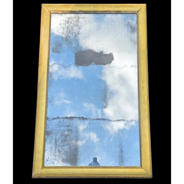 This 18th 18th-century Heavily Foxed Mercury Neoclassical Mirror is an evocative and richly aged piece with commanding...