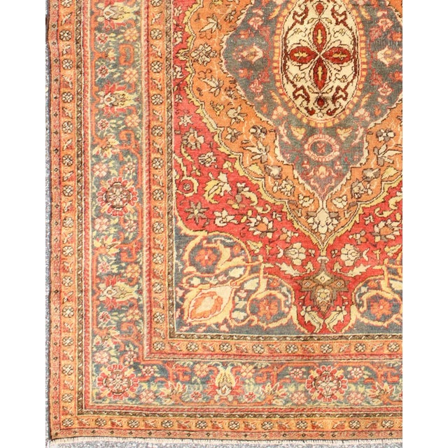 Turkish Antique Antique Persian Haji Jalili Rug With Multi-Layered Medallion in Soft Red, Teal & Orange For Sale - Image 3 of 7