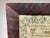 This is a 19th-century needlework sampler dated 1839 and signed by Susanna Rolfe. The piece features alphabet rows, a...