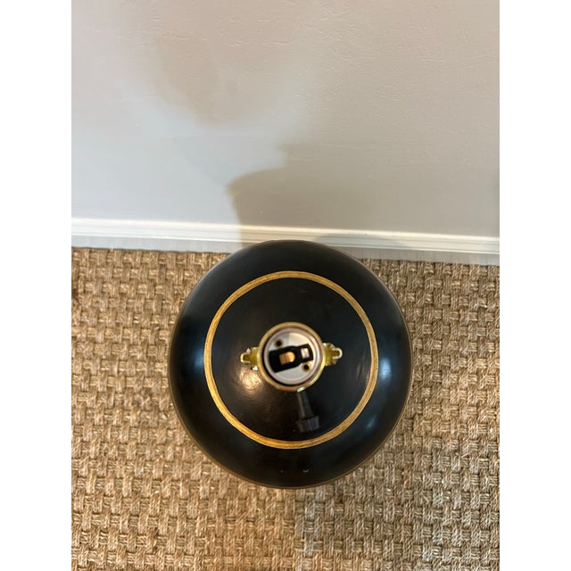 This black Victorian Tea Tin with gilded ribbons from the 19th-century custom light would be a great fit in a home to add...