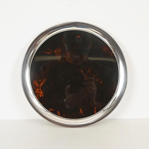 Marvelous large round serving tray or centerpiece in silver-plated metal and tortoiseshell-effect acrylic glass. This...
