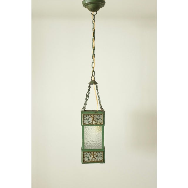 Charming circa 1920'/30s Swedish Grace Green painted Metal and Glass Pendant. Each side is decorated with two images, one...