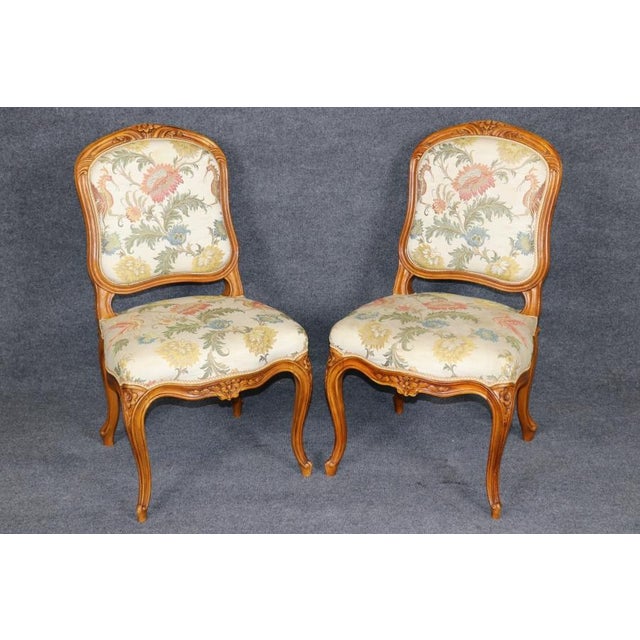 An **extraordinarily rare and magnificent set of 24 French Louis XV style dining chairs**, representing a truly...