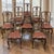 A handsome set of eight late 19th century antique dining chairs crafted from solid oak in the enduring Chippendale style,...