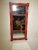 Federal gold gesso on solid wood mirror with distressed mirror glass. It has been painted a terrific red with gold accents...