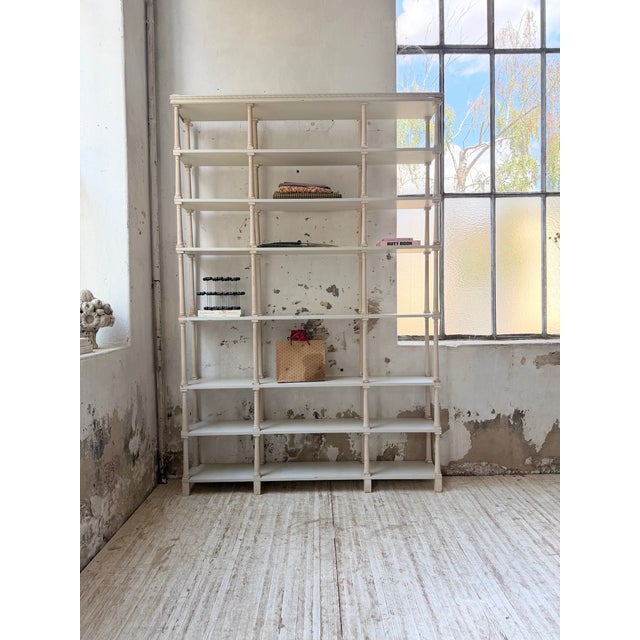 Antique bookcase or shelving unit in an xl napoleon-style format, with a beautiful white patina. we love its clean lines,...