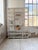 Antique bookcase or shelving unit in an xl napoleon-style format, with a beautiful white patina. we love its clean lines,...