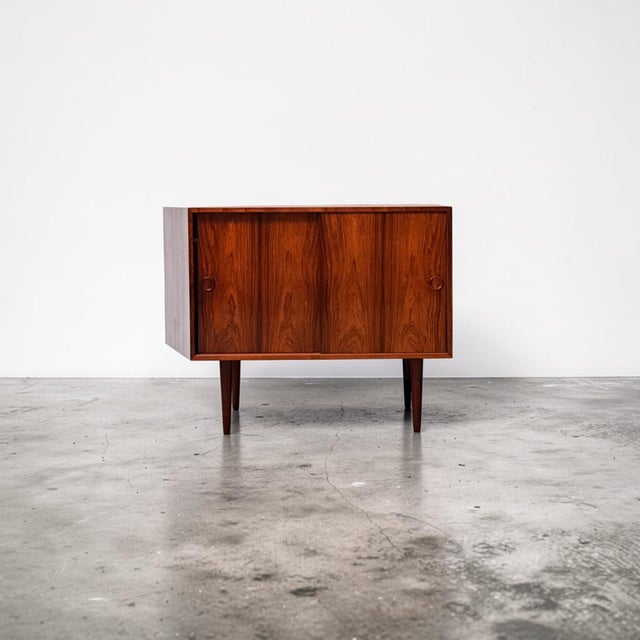 Rosewood cabinet designed by kai kristiansen for feldballe møbelfabrik, denmark, c. 1960s. a refined danish modern cabinet...
