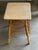 Vintage bamboo and rattan side table from the 1970s, featuring a built-in double magazine rack. Its natural bamboo frame...