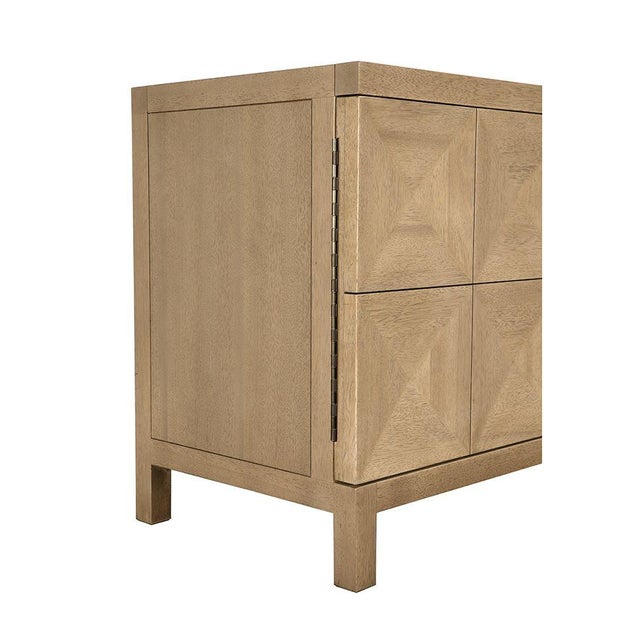 This extra-large four-door sideboard features a geometric face in a warm Washed Walnut finish. Its elongated profile,...