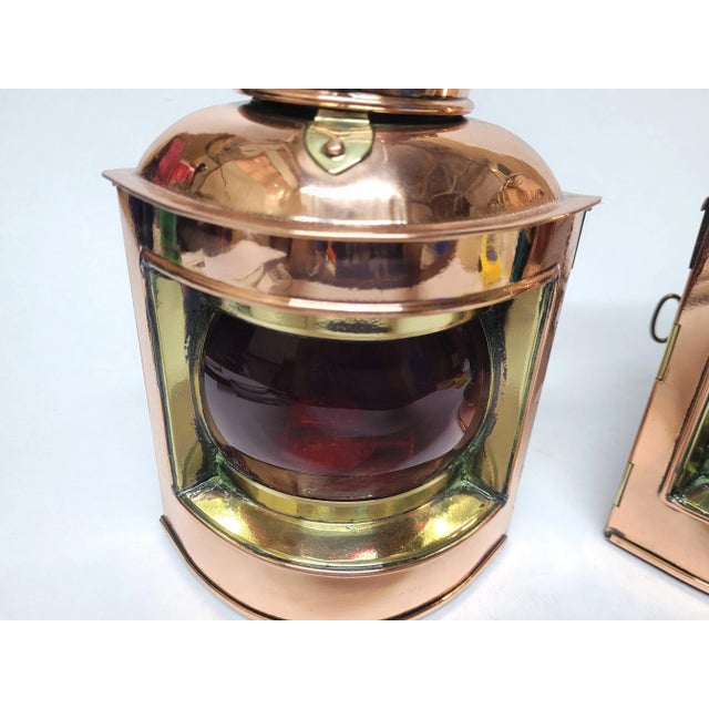 Polished copper and brass ships lanterns by English maker. Red and green glass lenses. Original oil burners. Meticulously...