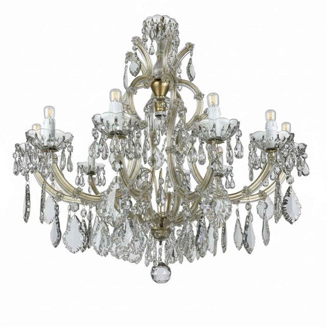 A 1950s maria teresa crystal living room chandelier, richly decorated with crystal pendants, features twelve curved arms...