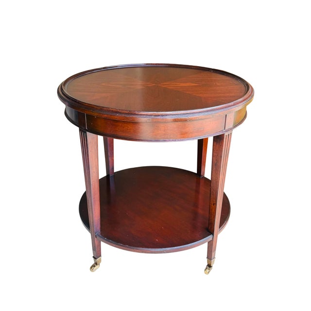 Baker Furniture Company Vintage Mahogany Two-Tier Side Table | Bookmatched Starburst Top | Fluted Legs | Brass Caster Feet For Sale - Image 4 of 11