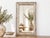 There is a quiet poetry in repurposing the past. This mirror was once a functional antique window frame, perhaps looking...
