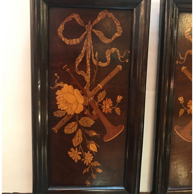 A pair of diminutive mahogany and satinwood inlaid framed panels. The wood panels with inlays of kings wood, tulip wood...