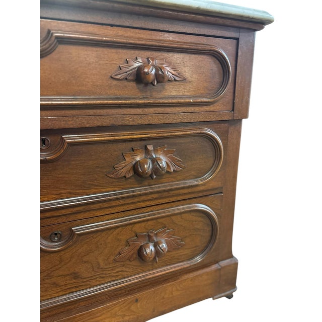 A beautiful late Victorian walnut dresser dating to approximately 1880–1900, showcasing elegant Eastlake and Renaissance...
