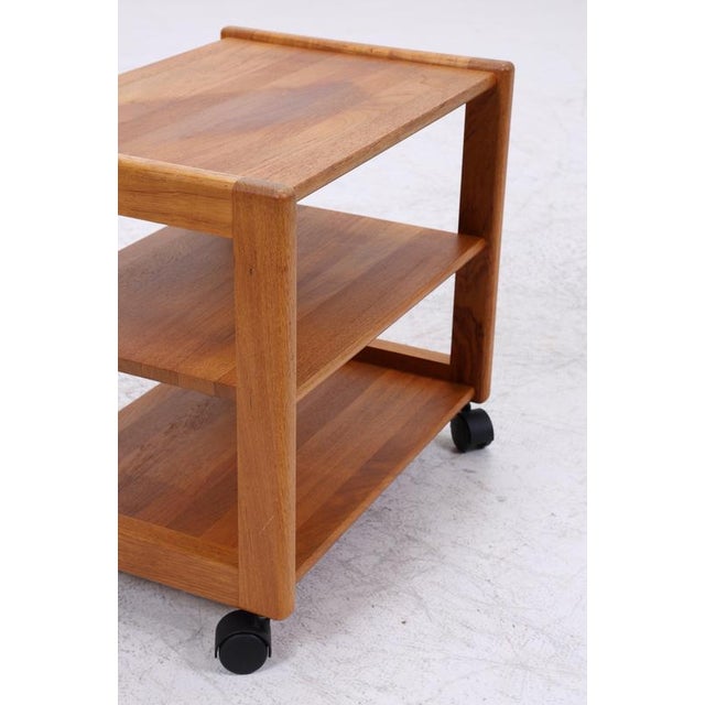 Vintage teak serving trolley with a beautifully simple design. The open shelves and casters make it versatile, suitable as...