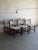 This stunning set of six dining chairs features a clean sculptural silhouette with striking vertical backrest pillars and...