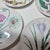 Four gorgeously illustrated Asian botanical plates- ginger, poppy, saffron and sesame seed plants on decorative plates.