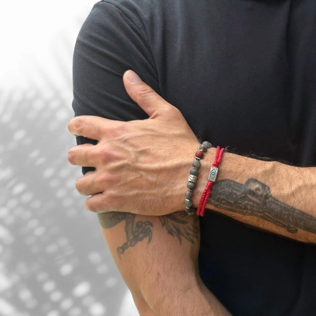 Exude strength and power with the African Bloodstone & Silver Eagle Beaded Bracelet, a unique and striking accessory...