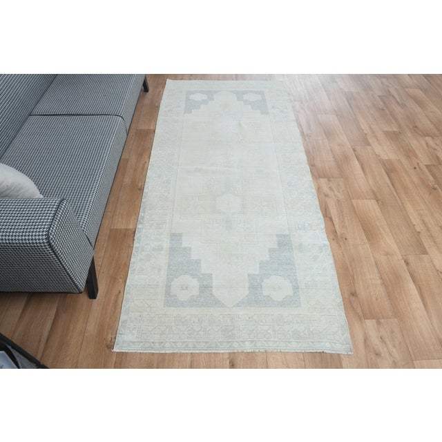 This vintage hand-knotted area rug is a semi-antique vintage area rug. The '70s Eastern region of Anatolian's unique rug...