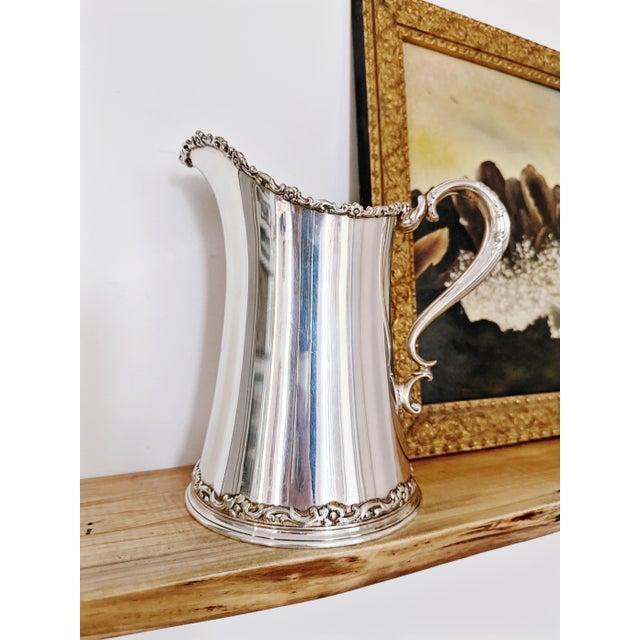 A stunning antique circa late 1800s silver plated water pitcher made by Tiffany & Co! In amazing condition for its age,...