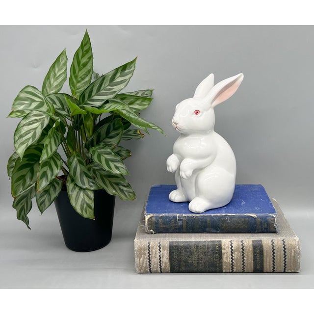 A delightful and expressive Fitz & Floyd porcelain rabbit sculpture, dated 1975 and made in Japan. This charming piece...