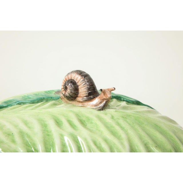 Of oval form; the lid with snail finial.