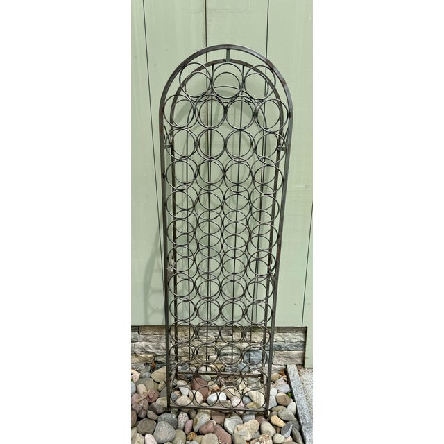 51 bottle iron wine rack, custom artisan crafted & purchased in Sausalito in the 1990s. Attractive, sturdy, and functional...