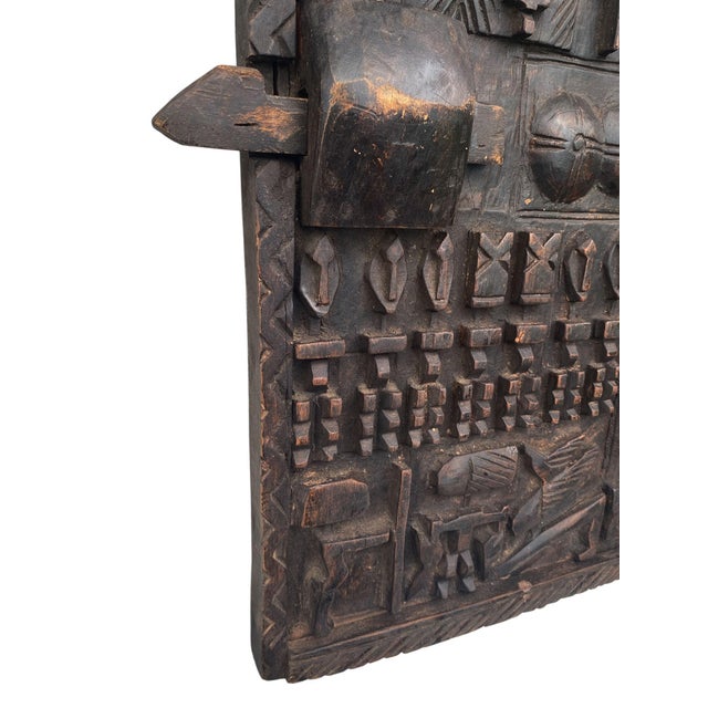 This impressive dark brown door from Mali showcases ancestral Dogon figures alongside breasts ,house, crocodile, and more....