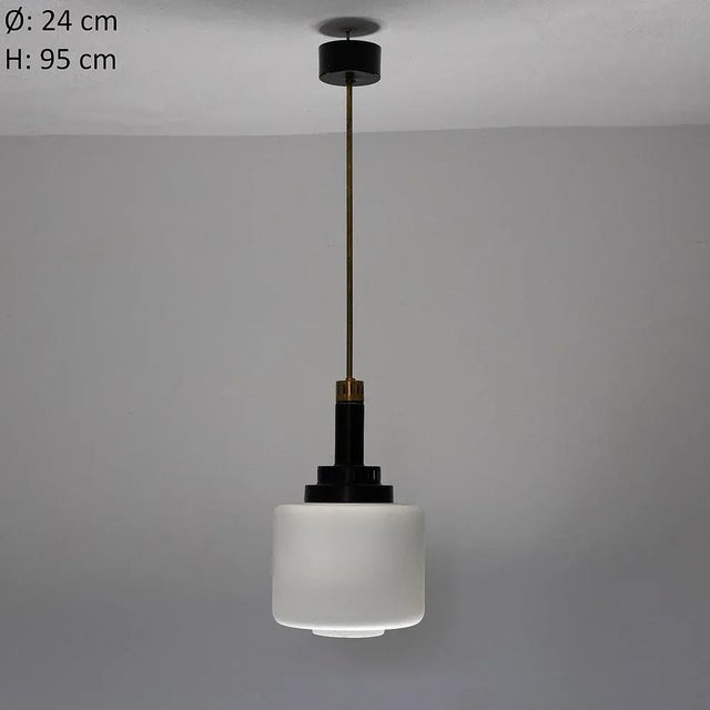 Pendant with black painted metal frame, brass stem and glass diffuser. Italian production from the 1950s. Up to 250V...