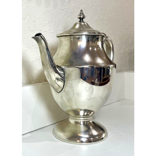 Lehman Brothers Silverware Corp. Vintage Silver Plated on Copper Tea Pot with Pedestal Base and Ornate Handle. Height is...