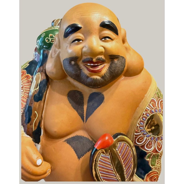 Impressive large antique Japanese Satsuma earthenware okimono depicting Hotei, the beloved Japanese God of Happiness,...