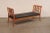 A Biedermeier inspired Swedish carved-wood sofa bench with upholstered seat, from the early 19th century. This bench comes...
