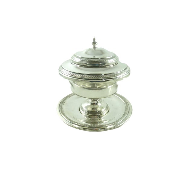 A French silver plate caviar server on a pedestal base with lid, glass insert, holding ring, and tray. Consisting of five...