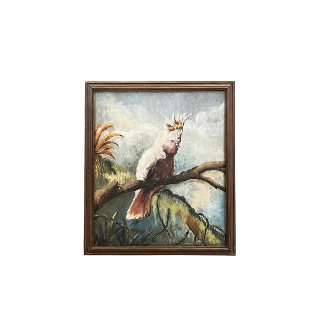 A pair of mid-20th-century oil paintings on panel depicting two different species of cockatoos, one white and one pink....