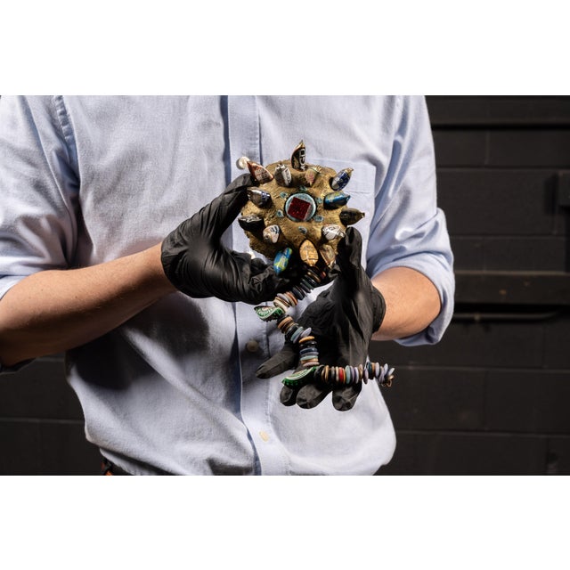 A distinctive repurposed mixed-media sculpture by Chicago artist Gregory Warmack, better known as Mr. Imagination...