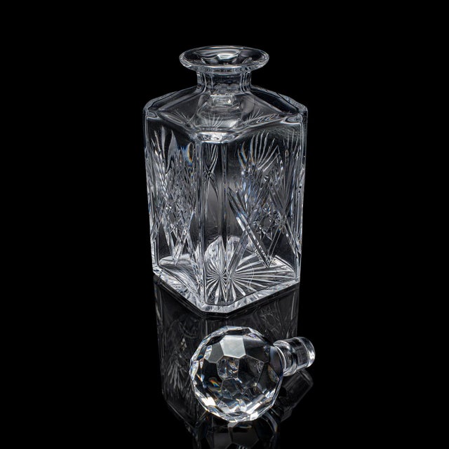 This is a vintage Scotch decanter. An English, cut glass whiskey bottle, dating to the late 20th century, circa 1970. A...