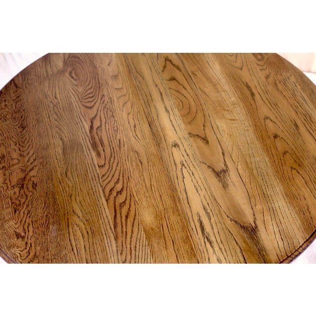 A round coffee table in oak with wonderful carving details on the legs of wolves or monsters or gargoyles. Made around the...